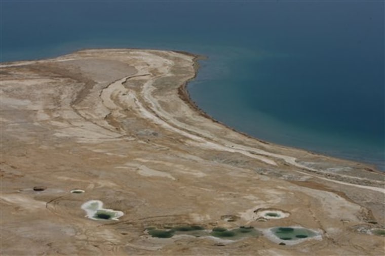 Only pools of water remain where the Dead Sea once reached in this June 2006 photo. Scientists in Israel drilled into the murky depths of the Dead Sea in hopes of unearthing scientific treasures found in 500,000 years worth of mud and sediment. 